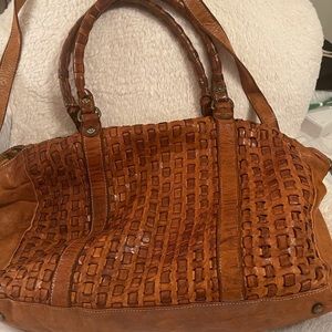 Leather woven style tote bag with straps.  Inside zipped pocket and phone slot